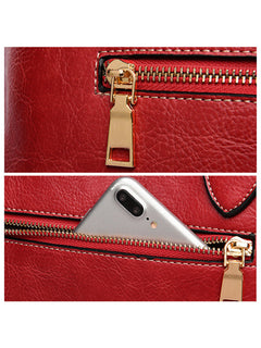 Gold-tone zipper and rear phone pocket detail on red rose tote bag