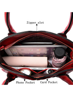 Interior compartments of red embossed rose tote with tablet and umbrella