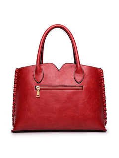 Back view of red embossed rose tote bag with zipper pocket
